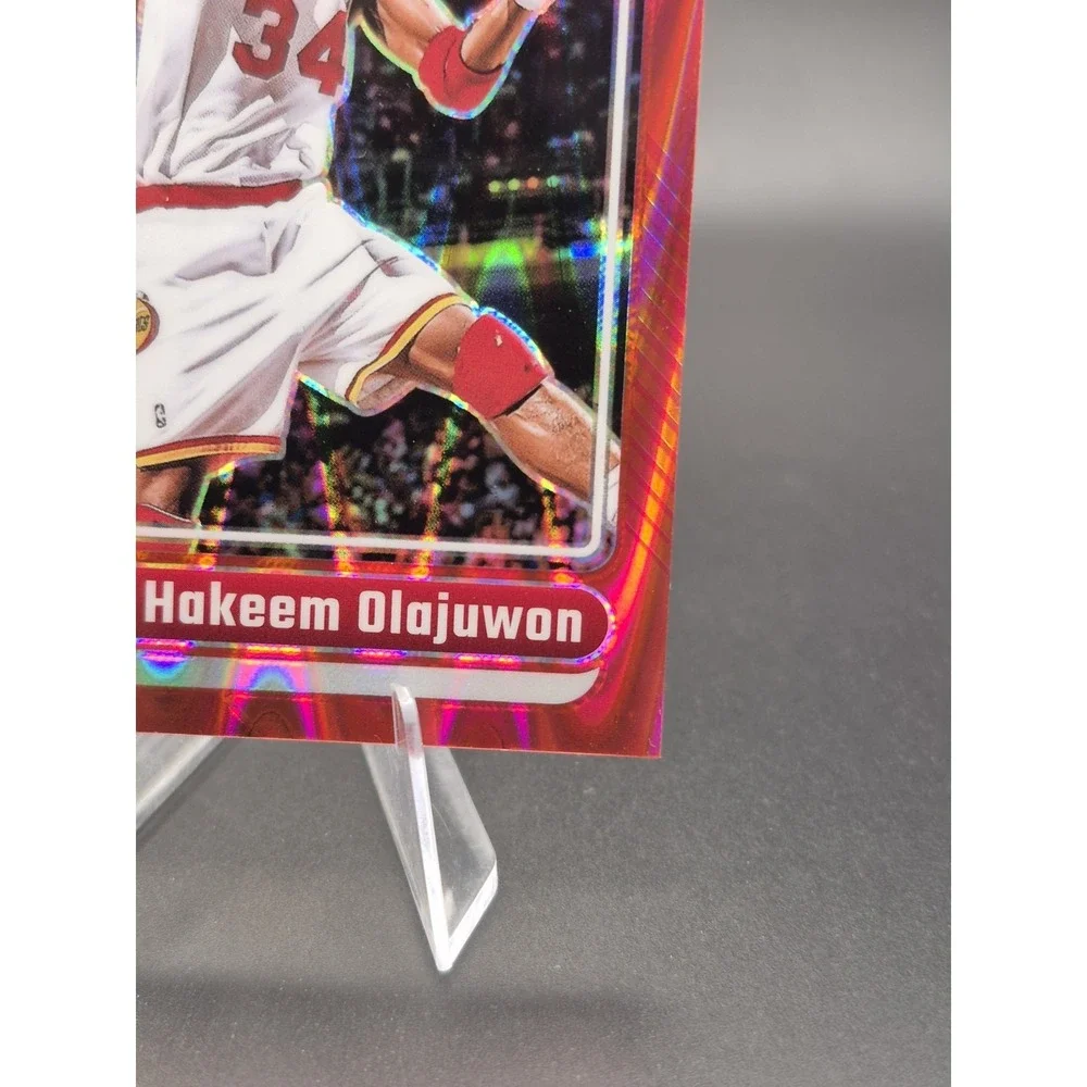 2024-25 Panini Optic Hakeem Olajuwon #249 Legends Red Seismic Prizm /149 Rockets